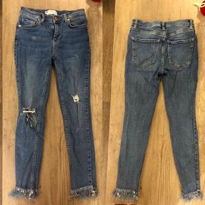 Blue Levi’s ripped jeans